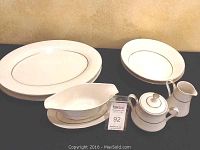 Full hostess set of Royal M China Engagement pattern on display including platters, bowls, gravy boat, sugar and creamer.