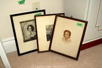 Three framed charcoal drawings leaning against wall showing scale and relative sizes