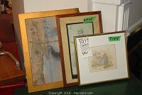 Three framed pictures including one large colored sketch, one medium portrait sketch, and one small colored market scene sketch