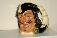 Front view of ceramic character jug of Captain Henry Morgan showing detailed facial features and handle.