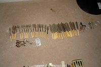 Overview of bone-handled flatware including forks, knives, spoons, decorative spoons and cocktail fork