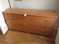 Front view of the pine dresser showing six drawers and overall condition.