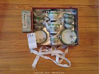 Full set of Japanese miniature tea set shown in original box with a blue label box and fabric ribbons.