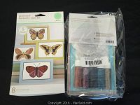 Front and back of packaged glittered butterfly card kit showing butterfly designs and glitter tubes.