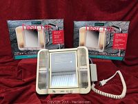 Four Jerdon First Class Swing-A-Light extendable makeup mirrors in white plastic with cords and original boxes behind.