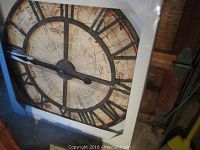 Mapa wall clock front view showing full clock face with Roman numerals and vintage map design.