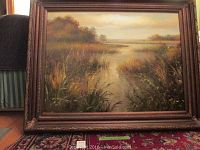 Frontal view of oil painting in frame