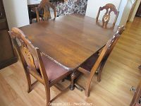 Dining table and chairs set with table top and seats visible