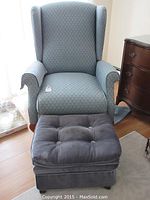 Front view of chair and ottoman on wood floor
