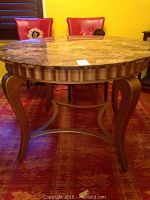 Side angle view showing the granite tabletop detail and metal legs.