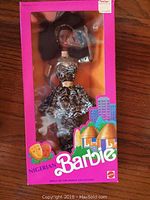 Nigerian Barbie doll in original pink box wearing animal print dress with silver accents and headband