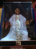 Full frontal view of Barbie doll in original labeled box wearing white gown and fur stole.