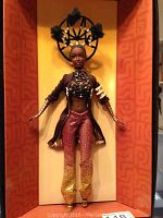 Full view of Byron Lars Moja Treasures Of Africa Barbie doll in original box, showing the complete doll wearing detailed clothing and accessories.