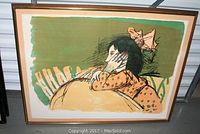 Full view of framed Alexander Dobkin lithograph showing title Little Kathy with woman resting her head, colorful print with green background