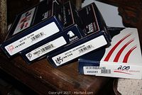 Four Annin branded boxes stacked, each labeled with a country name and product number indicating China, Bulgaria, Switzerland, and Venezuela flags.