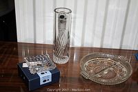Photo showing all three items: small Bohemian crystal dish, tall Bohemian vase, and round pressed glass dish.