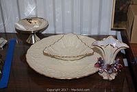 Four items displayed including Lenox platter, candy dish, silverplate pedestal dish and decorative case
