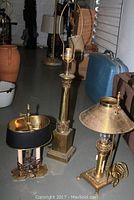 Photo showing all three lamps together on the floor: tall Stiffel lamp, antique metal torch lamp, and brass candelabra lamp