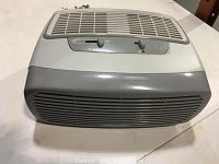 Front view of the Bonair BAP1242 air purifier showing the control knobs and air vents.