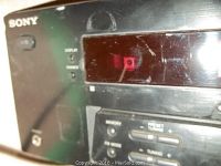 Close-up of front panel showing digital display and control buttons.