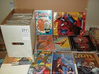 Box containing assorted comics including Justice League, Heathcliff, Superman, Indiana Jones, X-Force, and Wacky Witch visible on the cover.