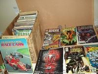 Box of various comic books with visible titles Spider-Man, Death's Head, Brigade, The Hornet, X-Force, Star Trek