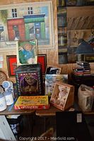 Overview of the lot showing multiple boxed games and dolls including the Operation game, teddy bears, Zultan fortune teller box, and Cabbage Patch doll.