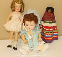All three dolls displayed together showing size and condition
