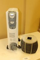 Two portable heaters: one Kenwood oil-filled radiator heater and one round compact space heater side by side.