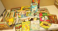 Wide view of assortment of vintage children's books including Whitman Tell-A-Tale, Little Golden Books, and other titles.