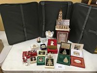 Photo of entire collection showing various Christmas ornaments and figurines including lighted church and angel figurines.