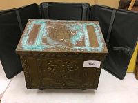 Front view of the antique hammered brass wood covered box with relief design and verdigris patina.