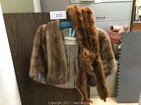 Short beige-brown mink stole with Bernard Held label inside hanging on blue hanger