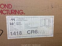 Close-up photo of the packaging label showing Hammond Manufacturing logo, model number 1418 CR6, and electrical panel box details.