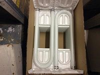 Box of U-shaped white Philips fluorescent tubes.