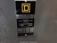 Close-up of Square D logo and rating label on switch panel door showing 400 amp rating and electrical specifications.