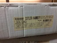 Close-up of Cutler-Hammer LM2 meter socket box label showing catalog number, voltage rating, and amperage specifications.