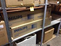 Shelved cardboard boxes labeled Philips, containing tubes