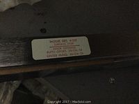 Label with model number and door opening specifications on door stop