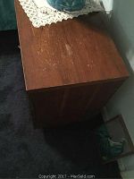 Top and side view showing surface scratches on the nightstand.