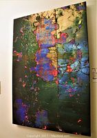 Full frontal view of the 24x36 abstract photographic canvas showing colorful textured surface with blacks, greens, blues, and purples interspersed with golden and pink highlights.