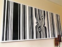 Full front view of the framed abstract painting mounted on wall