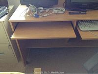 Computer desk with two pull-out shelves shown empty, view from front, showing condition and dimensions