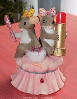 Front view of Fitz & Floyd Charming Tails resin mouse figurine showing two mice holding a mirror and lipstick on a pink cushioned base with ladybug detail.