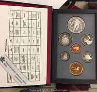Photo of the seven coins in the black case along with the Royal Canadian Mint logo and specification sheet showing metal composition and details of each coin.