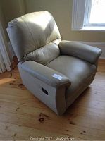 Angled view of full recliner front showing seat, backrest and arms