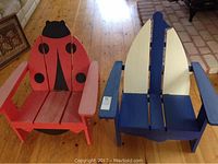 Front view of red ladybug and blue sailboat children's chairs side by side showing their painted designs and dimensions