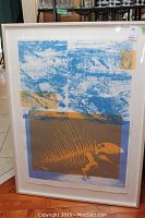 Full view of framed serigraph showing abstract blue and orange composition and fish skeleton