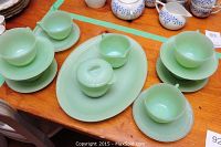 Overview of Fire King jadeite set showing platter, sugar bowl, creamer, cups and saucers