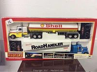 Boxed Hammerdown Haulers two truck set showing Shell tanker and Sears RoadHandler hauler trucks plus two remotes in original packaging.